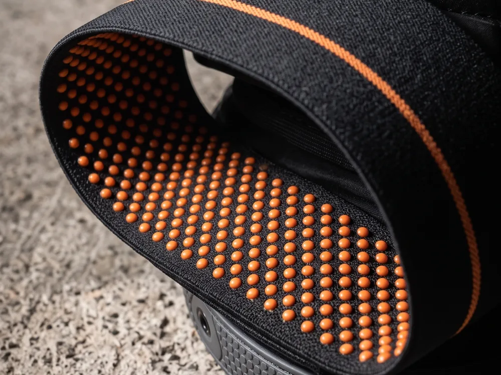 Render of the inside of the knee pad thigh band showing orange silicone grip dots